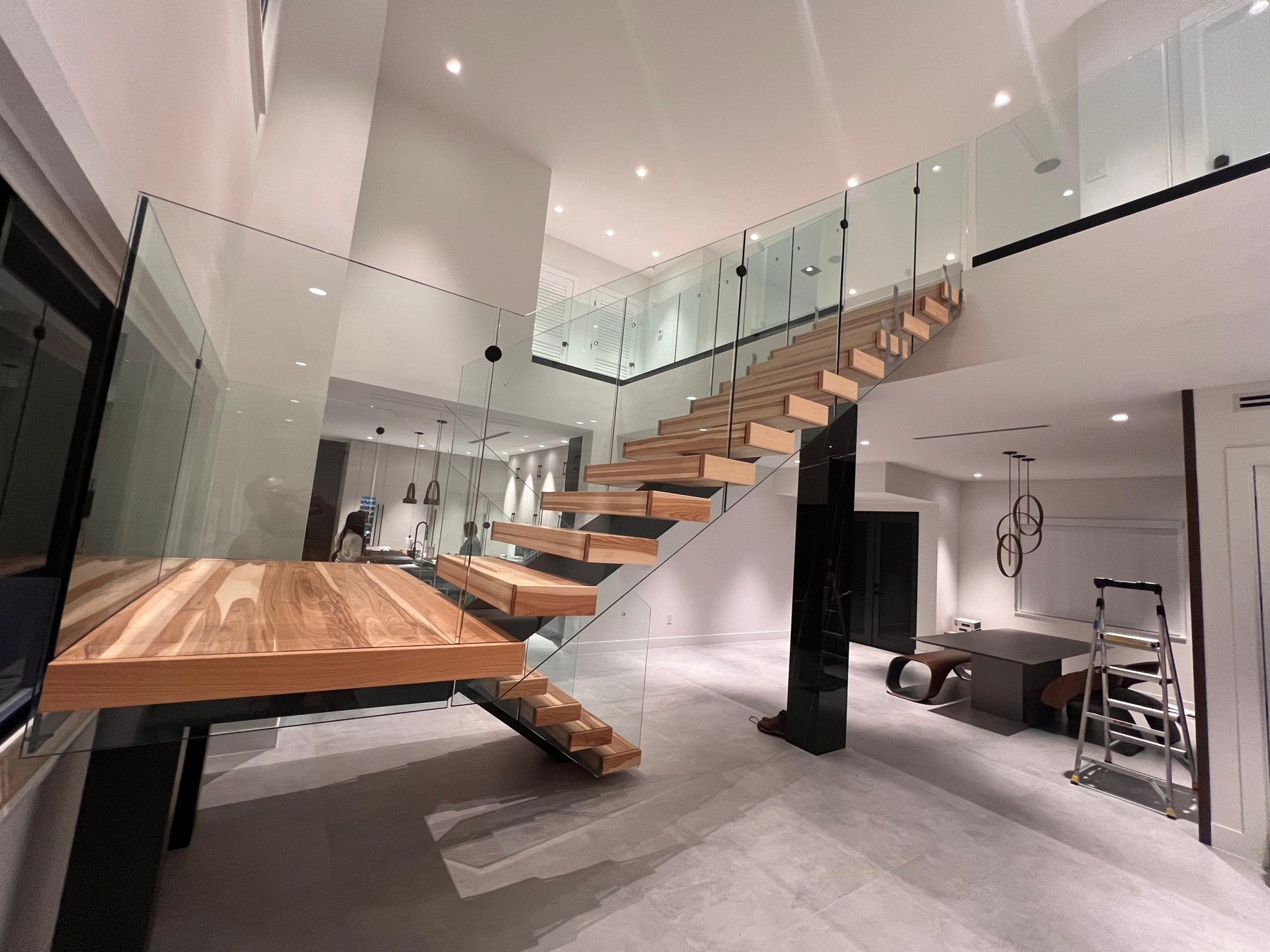 Floating staircase with glass railing